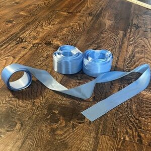 50+ individual Light Blue Satin Ribbonss. Each ribbon is 14 feet